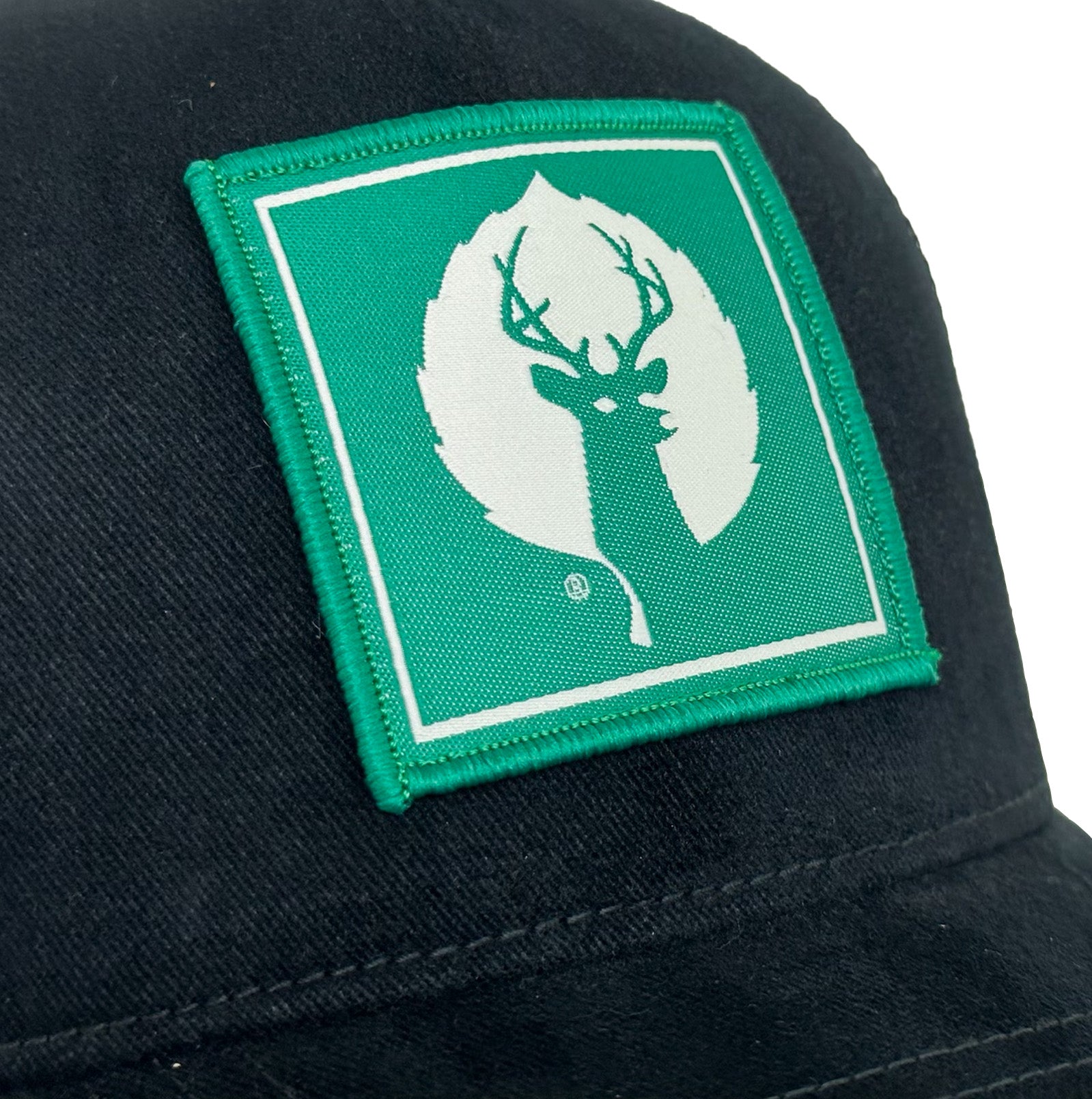 staff cap with green deer valley logo 
